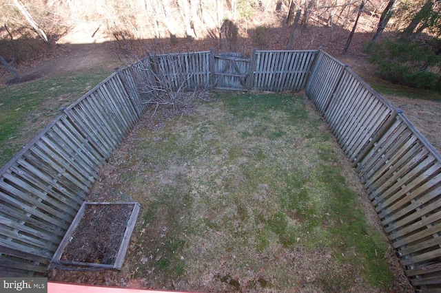 view of yard with a fenced backyard