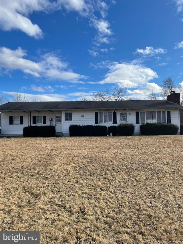 single story home with a chimney