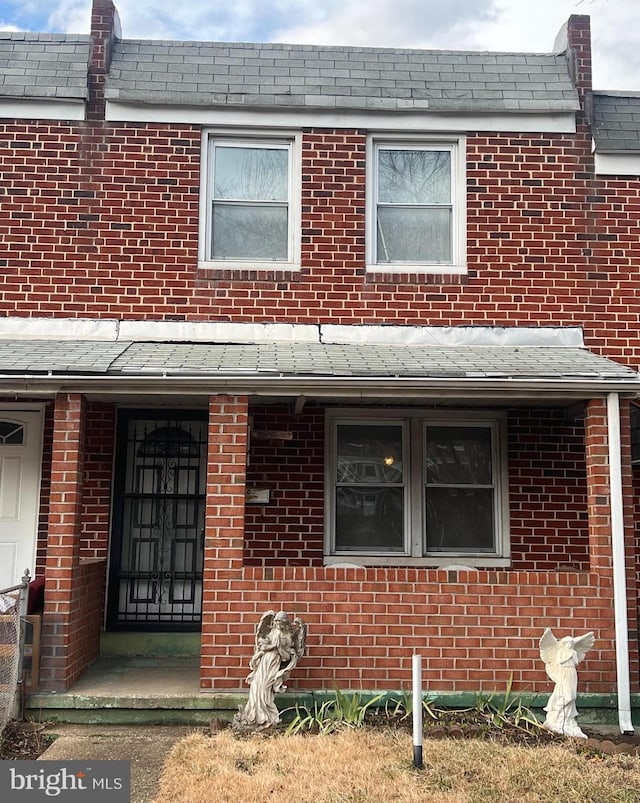 view of property with brick siding