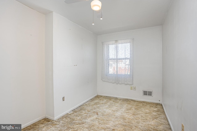 spare room featuring baseboards, visible vents, ceiling fan, and carpet flooring