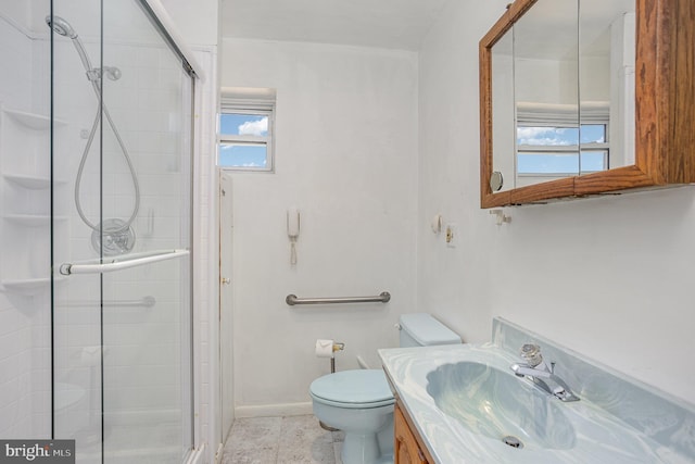 full bath with toilet, a shower stall, vanity, tile patterned flooring, and baseboards