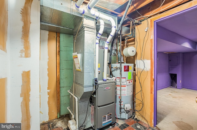 utility room featuring water heater