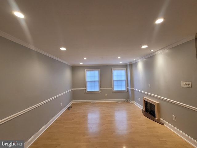 interior space with recessed lighting, a fireplace, light wood-style flooring, and baseboards