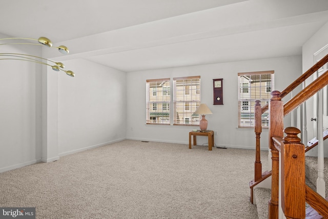 interior space featuring stairs and baseboards