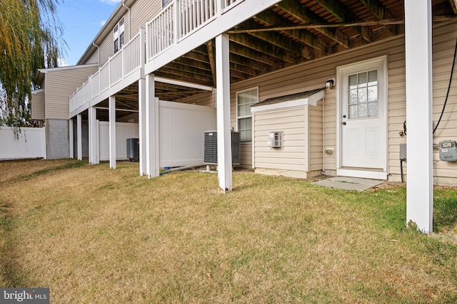 exterior space featuring a yard and central AC unit