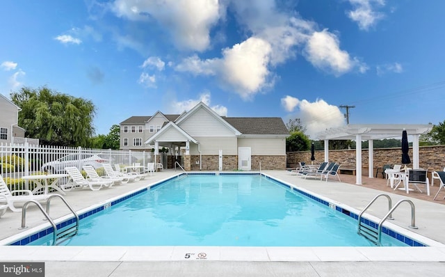 pool featuring a patio area, fence, and a pergola