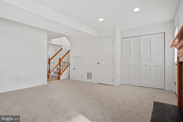 interior space with stairway, carpet, visible vents, and recessed lighting