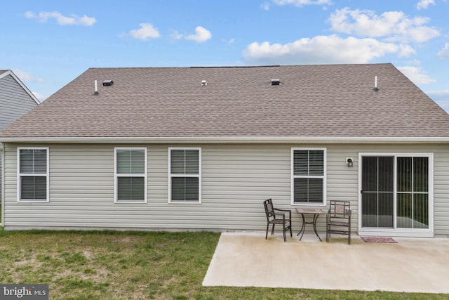 321 Windflower Dr Unit 9, Millsboro, DE 19966 - rear view of house with a patio area, a lawn, and roof with shingles