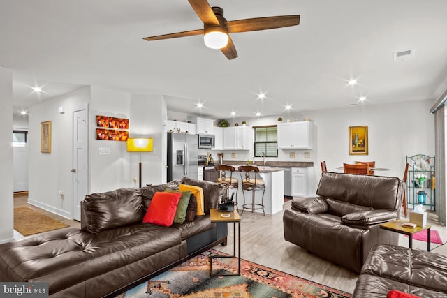 321 Windflower Dr Unit 9, Millsboro, DE 19966 - living area with a ceiling fan, recessed lighting, visible vents, and wood finished floors