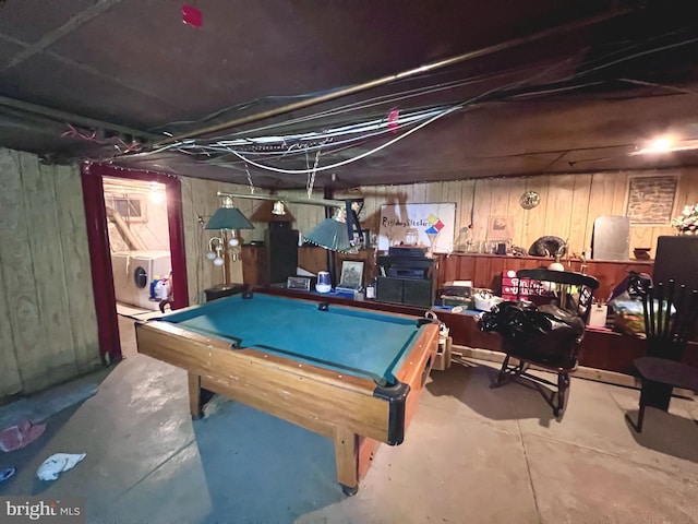 rec room featuring concrete flooring, washer and dryer, and pool table