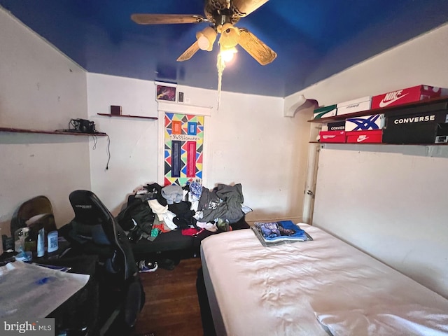 bedroom with ceiling fan and wood finished floors