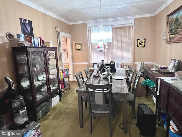 carpeted dining area with a notable chandelier and crown molding