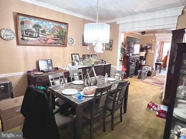 dining space with a notable chandelier and crown molding