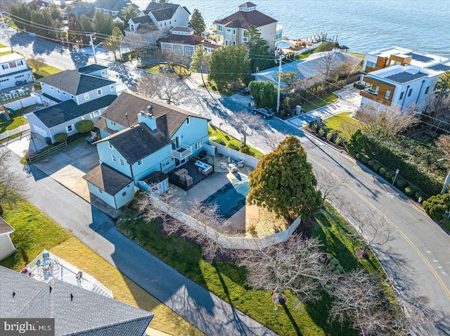 birds eye view of property with a residential view