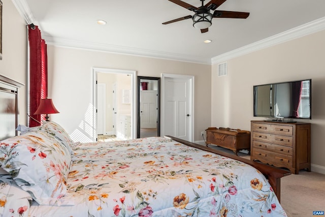 bedroom with visible vents, baseboards, ceiling fan, ornamental molding, and carpet