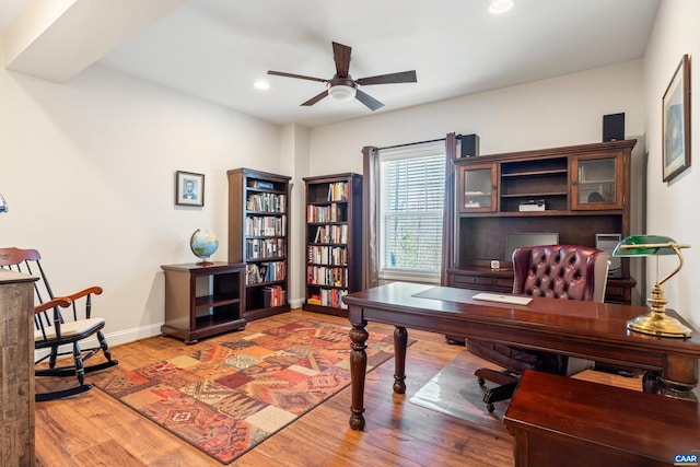 office space with a ceiling fan, light wood-type flooring, baseboards, and recessed lighting