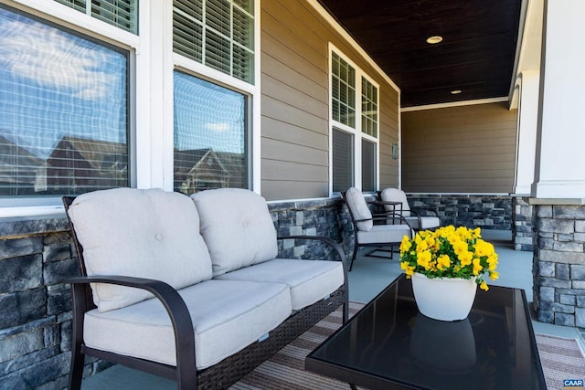 exterior space featuring covered porch and an outdoor hangout area