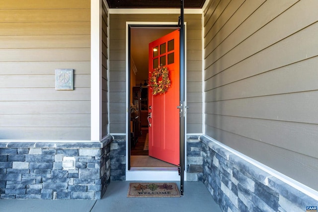 view of exterior entry with stone siding