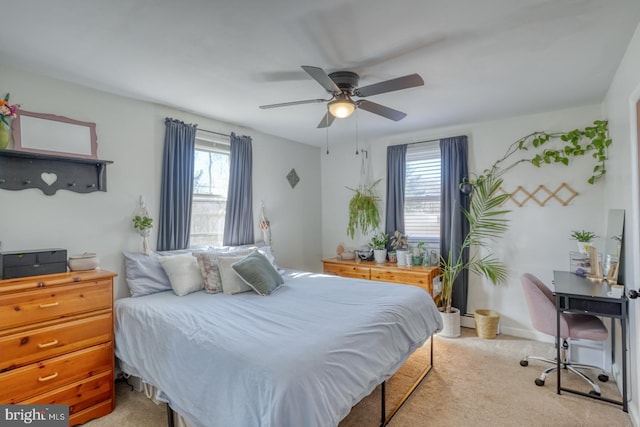 bedroom with light carpet and ceiling fan