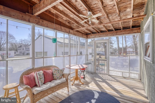 sunroom featuring a ceiling fan