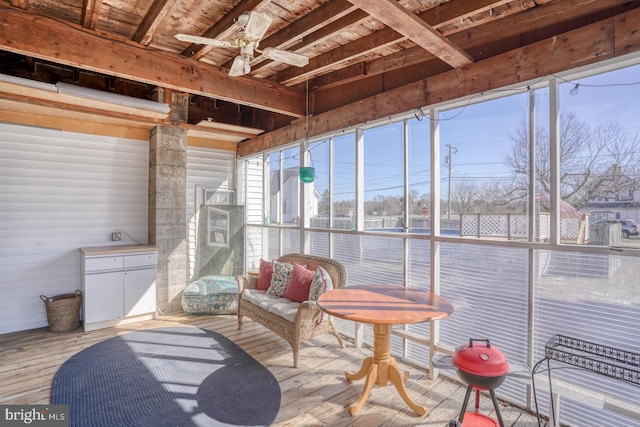 sunroom / solarium featuring ceiling fan