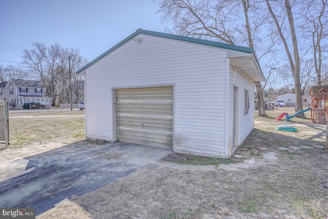 detached garage featuring driveway