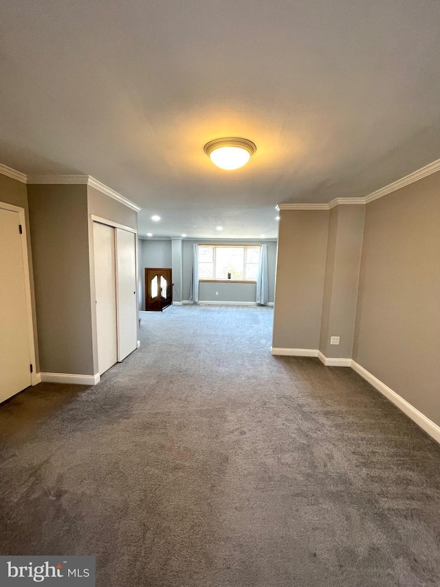 interior space featuring baseboards, crown molding, and recessed lighting