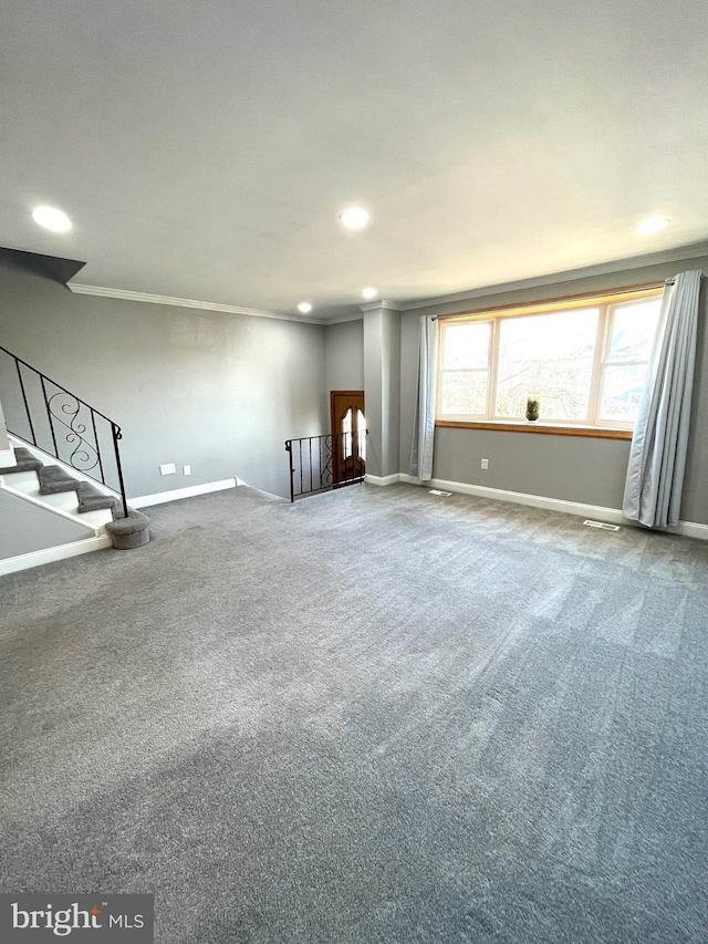 unfurnished living room featuring carpet floors, crown molding, stairway, and baseboards