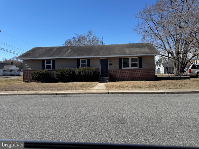 view of front of home with brick siding