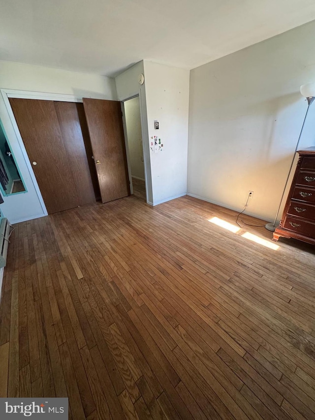 unfurnished bedroom featuring wood-type flooring