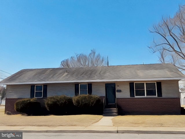 ranch-style home with entry steps and brick siding