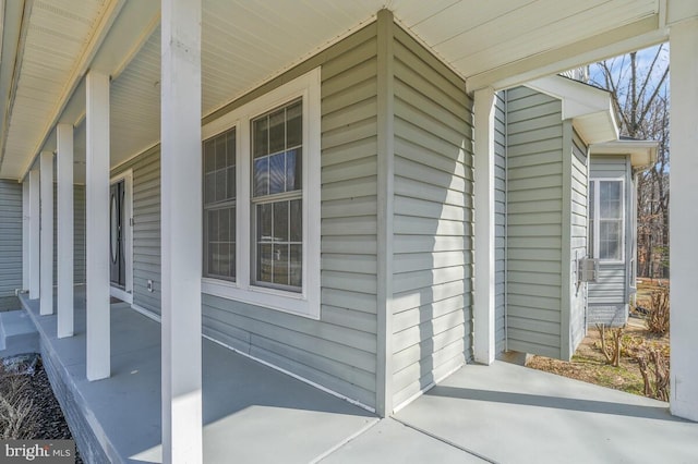 view of side of property featuring a porch