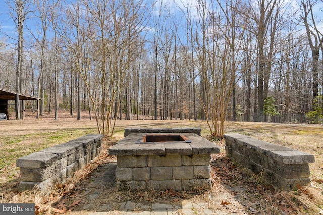 exterior space with an outdoor fire pit