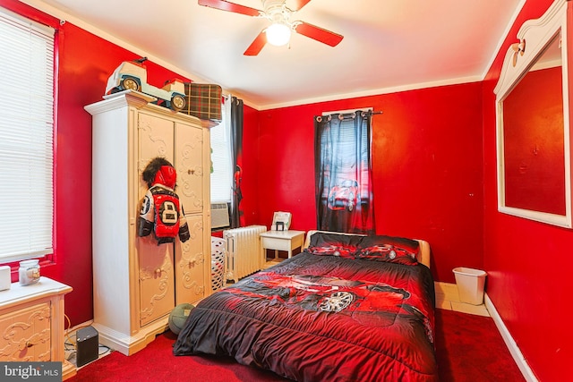 bedroom with radiator, multiple windows, ceiling fan, and baseboards