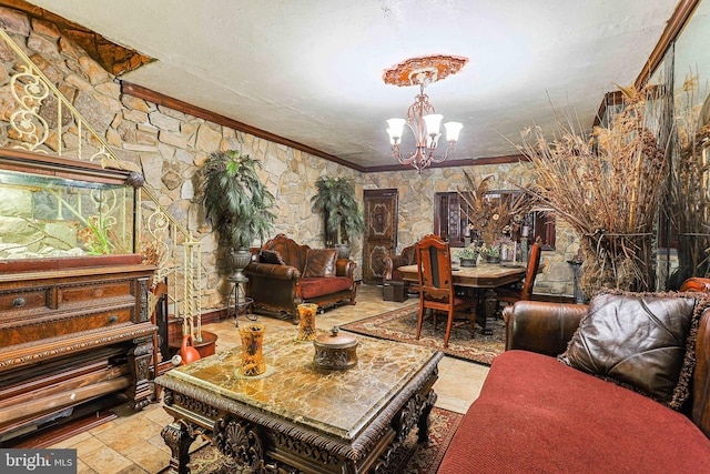 living area featuring a chandelier, stone tile floors, a textured ceiling, and crown molding