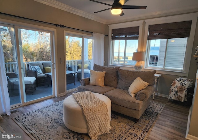 sunroom with a ceiling fan