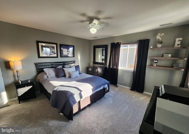 bedroom featuring light colored carpet, visible vents, ceiling fan, and baseboards