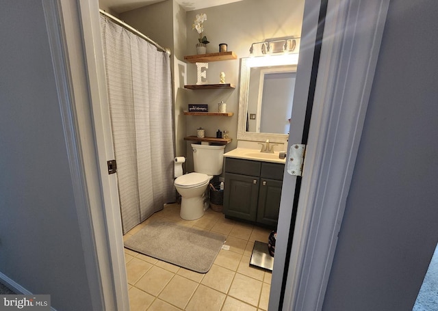 full bathroom with toilet, curtained shower, vanity, and tile patterned floors