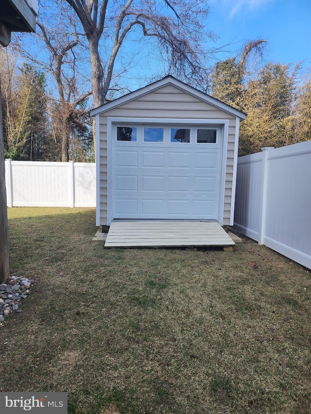 garage with fence