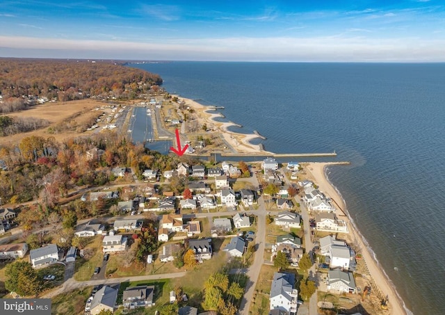 drone / aerial view featuring a water view and a residential view