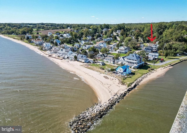 aerial view with a beach view and a water view