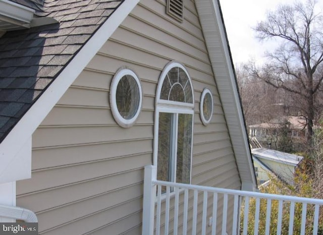 details featuring a shingled roof