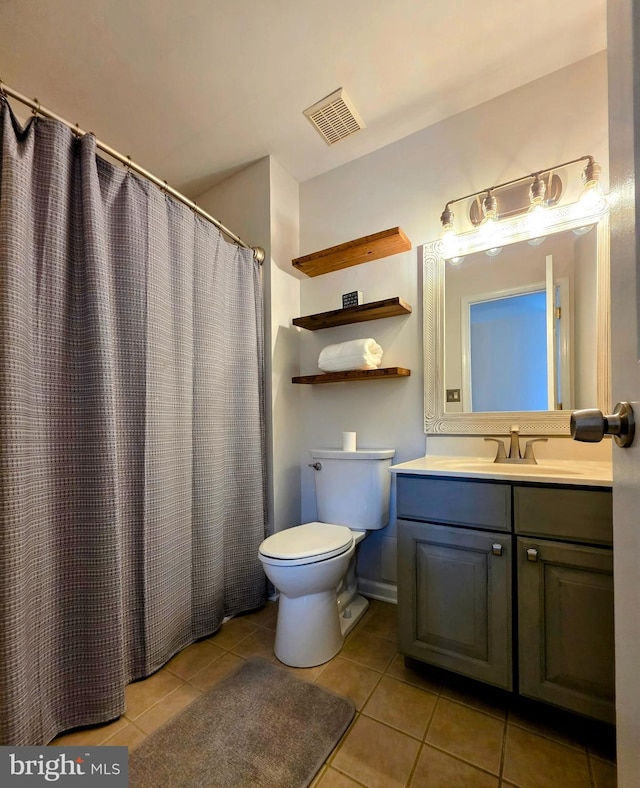 5128 Shore Dr, Huntingtown, MD 20639 - bathroom with toilet, tile patterned floors, vanity, and curtained shower