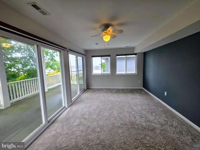 5128 Shore Dr, Huntingtown, MD 20639 - carpeted empty room featuring baseboards and ceiling fan