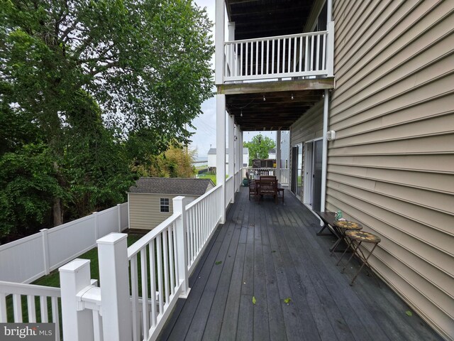 5128 Shore Dr, Huntingtown, MD 20639 - wooden terrace featuring a fenced backyard and outdoor dining space