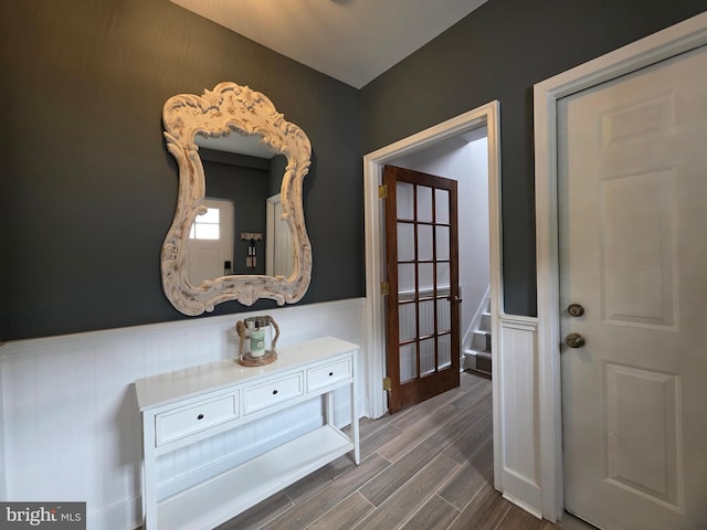 5128 Shore Dr, Huntingtown, MD 20639 - hall with wainscoting and dark wood-style floors