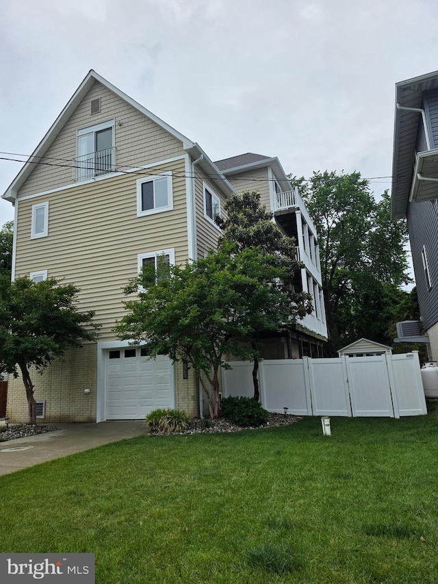 5128 Shore Dr, Huntingtown, MD 20639 - view of home's exterior featuring a garage and driveway