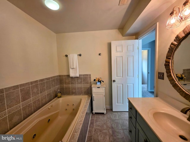 5128 Shore Dr, Huntingtown, MD 20639 - full bath with vanity, a whirlpool tub, baseboards, and tile patterned flooring