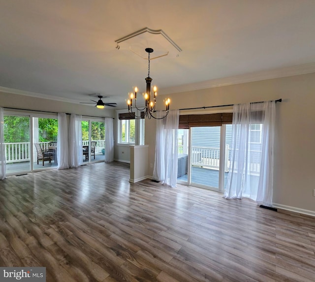 5128 Shore Dr, Huntingtown, MD 20639 - unfurnished living room featuring a chandelier, baseboards, crown molding, wood finished floors, and a ceiling fan