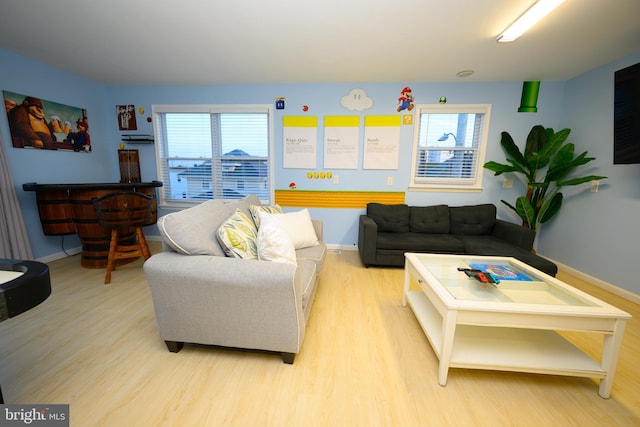 living room featuring light wood-style floors and baseboards